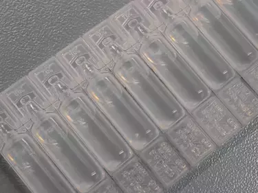 Calibrated leaks polymer drug vials