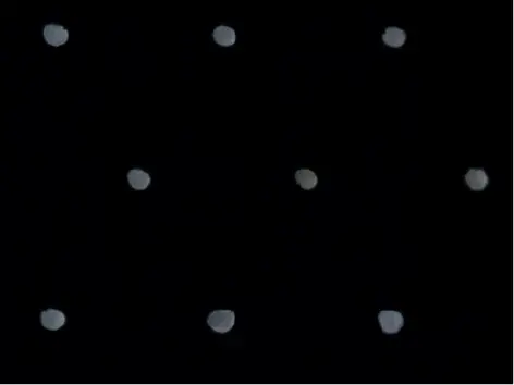 Array of 40 micrometer holes in 0.25 mm steel sheet.